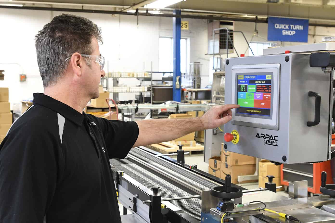 Person adjusting a touchscreen HMI